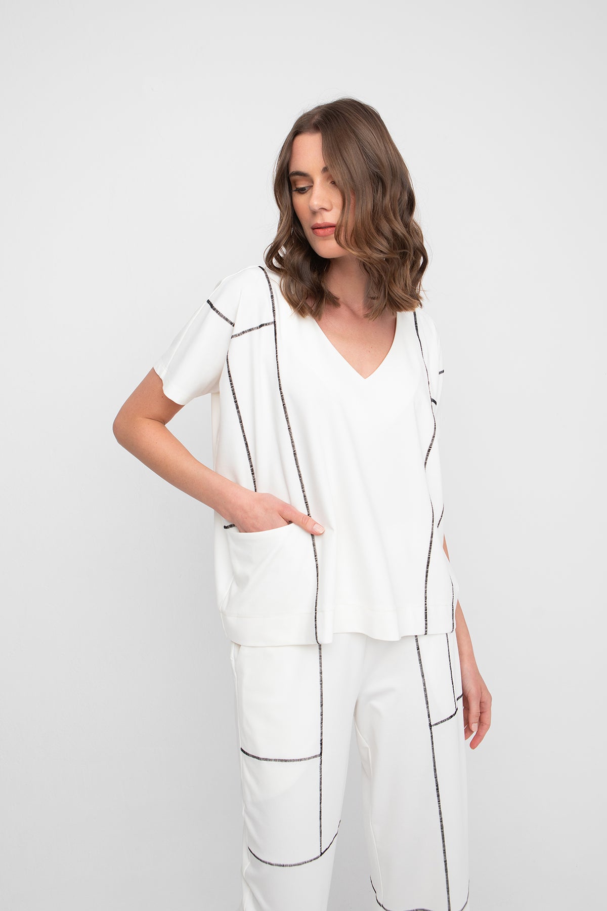 Ozai N Ku Front Pocket Ivory Top with Black Stitching